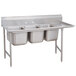 A stainless steel Advance Tabco three compartment sink with right drainboard.