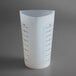 A white Tablecraft flexible silicone measuring cup with black writing.