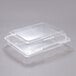 A Dart clear plastic oblong container with a clear lid.