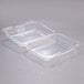 Two Dart clear plastic oblong containers with lids.