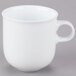 A close-up of a white Taverno porcelain mug with a handle.