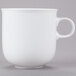 A close-up of a 10 Strawberry Street Taverno white porcelain mug with a handle.