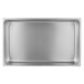 A Vollrath stainless steel rectangular water pan on a counter.