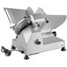 A silver Backyard Pro manual gravity feed meat slicer with a black cord.