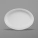 A white oval melamine platter with a white rim.