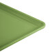 A lime green Cambro dietary tray with a corner handle.