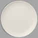 A close-up of a white RAK Porcelain Neo Fusion flat coupe plate.