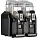 A black Fetco by Elmeco Big Biz frozen beverage machine with two containers and two dispensers.