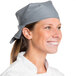A woman wearing a grey chef neckerchief.
