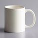 An ivory stoneware mug with a C-handle.