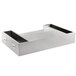 A silver stainless steel tray with two compartments on a counter.