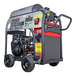A Simpson Big Brute portable gas powered pressure washer with a large engine on wheels.