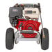 A red and white Simpson gas powered pressure washer on black wheels.
