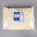 A Great Lakes Cheese 5 lb. bag of shredded mild white cheddar cheese.