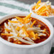 Shredded Laubscher Colby Jack cheese on a bowl of chili.