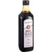 A bottle of Colavita Original Balsamic Glaze with a white label containing brown liquid.