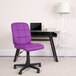 A purple Flash Furniture office chair in front of a black desk.