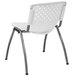 A Flash Furniture white plastic stack chair with a metal frame.