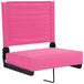 A pink seat with a black frame.