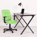 A Flash Furniture green mid-back office chair with arms next to a laptop on a table.