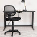 A Flash Furniture black mesh office chair with T-arms.