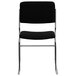 A Flash Furniture black fabric stacking chair with chrome legs.