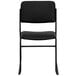 A black Flash Furniture Hercules Series stacking chair with a black seat and black vinyl back on a black metal frame.