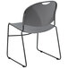A gray plastic Flash Furniture stack chair with black legs.