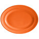 An orange oval Tuxton Concentrix china platter with a white rim.