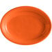 An orange oval Tuxton China platter with a white rim.