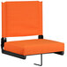 An orange seat cushion for bleachers with a black frame.