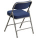 A navy blue Flash Furniture metal folding chair.