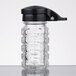 A clear glass Tablecraft shaker with a black lid.