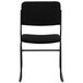 A black Flash Furniture banquet chair with a black fabric seat and back on a black metal sled base.