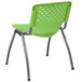 A Flash Furniture green plastic stack chair with a metal frame.