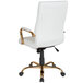 A white high-back office chair with gold arms and a chrome base.