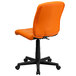 An orange Flash Furniture mid-back office chair with black wheels.
