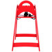 A red Koala Kare child's high chair with a black seat and strap.