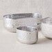 Three American Metalcraft silver oval hammered aluminum sugar packet holders.