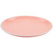 A pink GET Settlement Oasis melamine plate with a white rim.