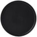 A black round Tuxton China plate with a white background.