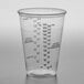 A Solo Ultra Clear plastic medical cup with measurements on a white background.