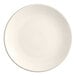 An Acopa ivory stoneware plate with a plain edge and a white rim.