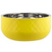 A yellow Bon Chef bowl with a silver rim.