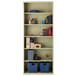 A Hirsh putty steel bookcase with blue and gray baskets on the shelves.