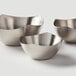 Three American Metalcraft stainless steel snack bowls on a white surface.