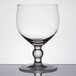 A clear Anchor Hocking Schooner Glass with a round base and small rim.