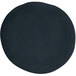 A black circle on a white melamine plate.