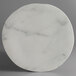 A white marble Carlisle melamine plate with a circular design.