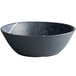 A Carlisle black soapstone melamine bowl with a marble effect and white rim.